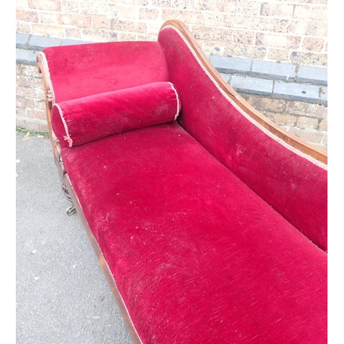 825 - AN EARLY VICTORIAN ROSEWOOD CHAISE LONGUE

with scrolled end and back, on brass castors 180cm long