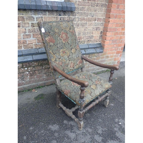 828 - A FRENCH 18th CENTURY WALNUT ARMCHAIR

with turned les and stretchers, and rectangular back 58cm wid... 