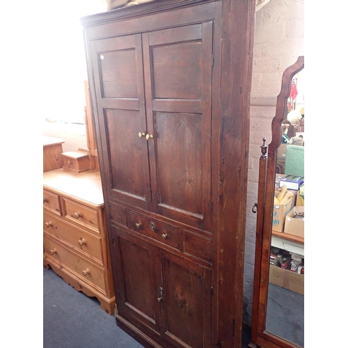 833 - A GEORGE III OAK CORNER CUPBOARD

two pairs of panelled doors enclosing shaped shelves, with single ... 