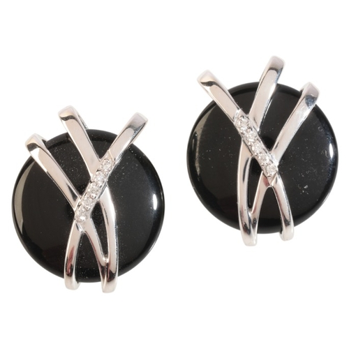 144 - A PAIR OF ONYX AND DIAMOND EARRINGS

in 9ct white gold, each set with a carved onyx disk, held in a ... 