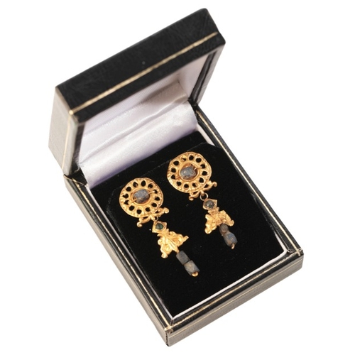 147 - A PAIR OF ANCIENT GEM-SET DROP EARRINGS

in high carat gold, each comprising an openwork disk, set t... 