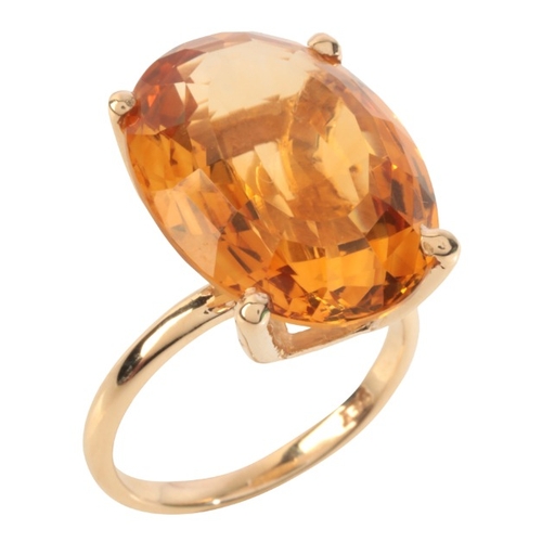 20 - A CITRINE COCKTAIL RING

in 9ct gold, set with an oval cut citrine of c.4.26 carats, stamped '9CT', ... 