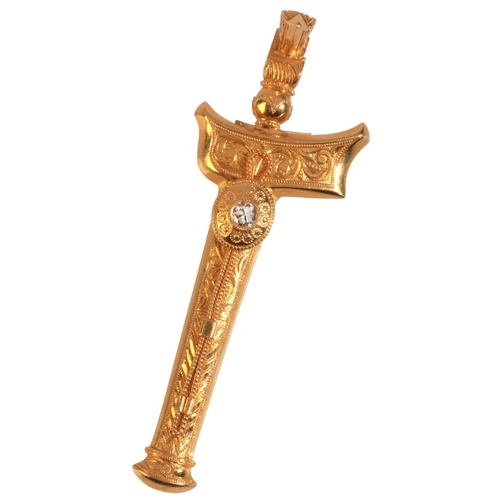 213 - A DIAMOND TORAJA KERIS SWORD BROOCH

in high carat gold, set with a round brilliant cut diamond, the... 