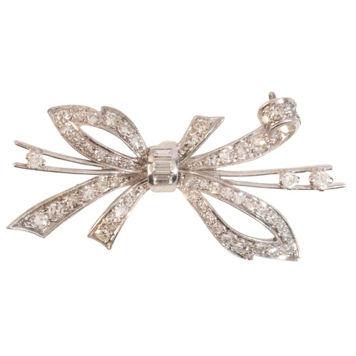 234 - A VINTAGE DIAMOND BOW BROOCH

in white gold and platinum, in a stylised bow design, set throughout w... 