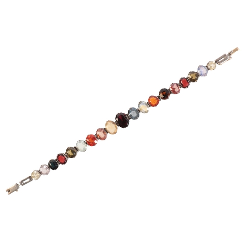 250 - A GEM-SET HARLEQUIN BRACELET

in silver, set throughout with garnets, aquamarines, sapphires, citrin... 