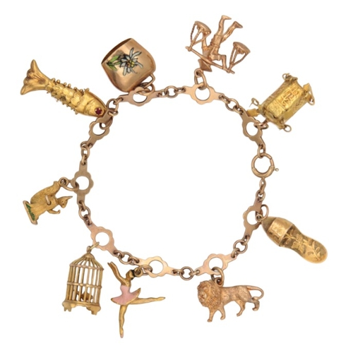 251 - A VINTAGE CHARM BRACELET

in 9ct and 14ct gold, comprising a series of stylised links, suspending ni... 