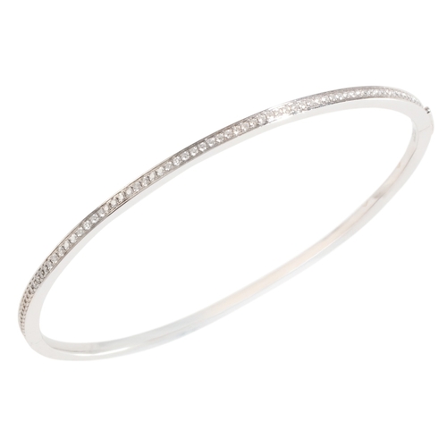 253 - A HINGED DIAMOND BANGLE

in 18ct white gold, set to one half with round brilliant cut diamonds, secu... 