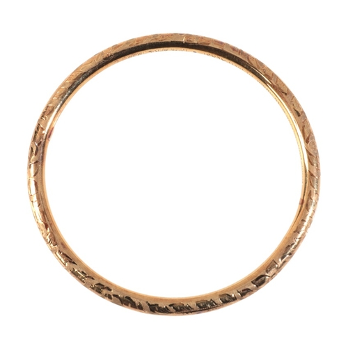 255 - A PRE-WORLD WAR II GOLD BANGLE

in 14ct gold, engraved throughout with floral details, stamped '585'... 