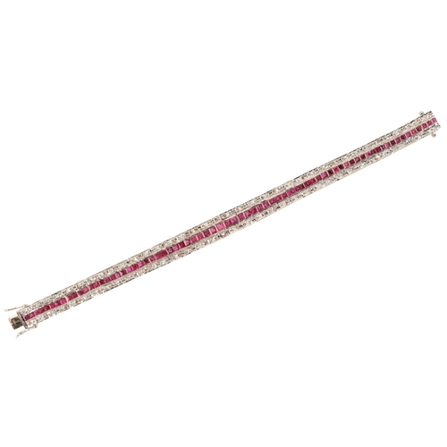 257 - A RUBY AND DIAMOND BRACELET

in 18ct white gold, set with a row of calibré cut rubies, totalling c.3... 