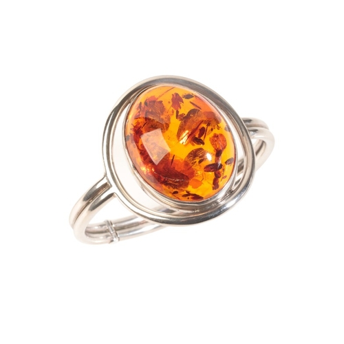 262 - A CONTEMPORARY AMBER BANGLE

in sterling silver, set with an amber cabochon of 39x30x16mm, c.54.59 c... 