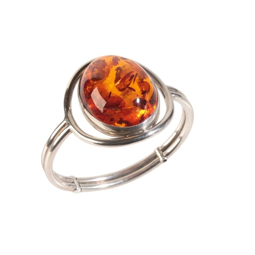 262 - A CONTEMPORARY AMBER BANGLE

in sterling silver, set with an amber cabochon of 39x30x16mm, c.54.59 c... 