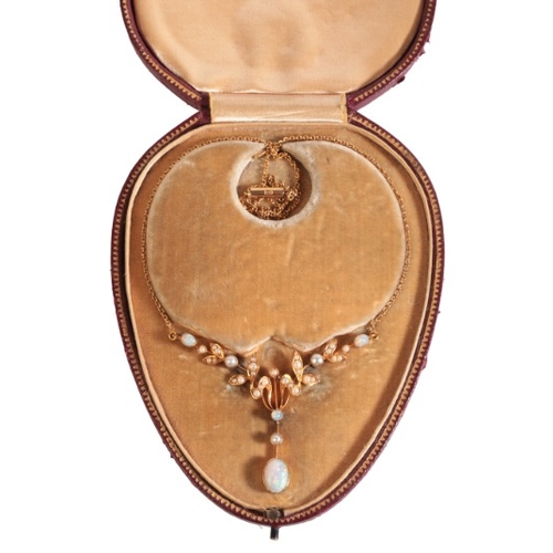 301 - AN ANTIQUE EDWARDIAN OPAL AND PEARL PENDANT NECKLACE

in 15ct gold, comprising a stylised floral pen... 