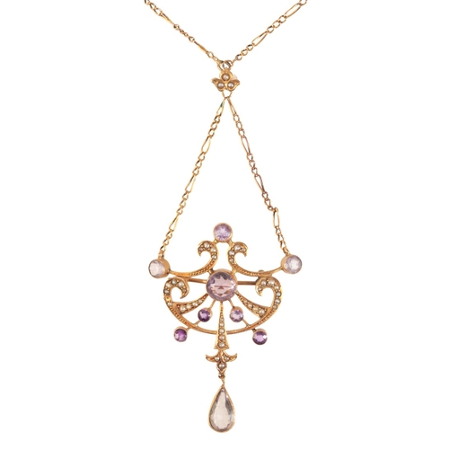 302 - AN ANTIQUE AMETHYST AND SEED PEARL LAVALIER PENDANT NECKLACE

in 9ct gold, in a stylised design, set... 