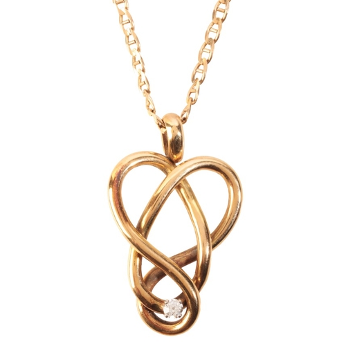 325 - A DIAMOND KNOT PENDANT NECKLACE

in 18ct gold, in a stylised knot design, set with a round brilliant... 