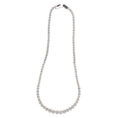 359 - A DIAMOND CLUSTER RIVIÈRE NECKLACE

in 18ct white gold, comprising a series of clusters of round bri... 