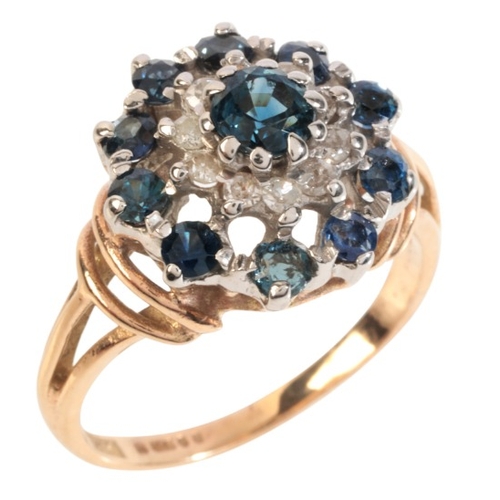 37 - A VINTAGE SAPPHIRE AND DIAMOND CLUSTER RING

in 9ct gold, set with a cluster of round cut sapphires ... 