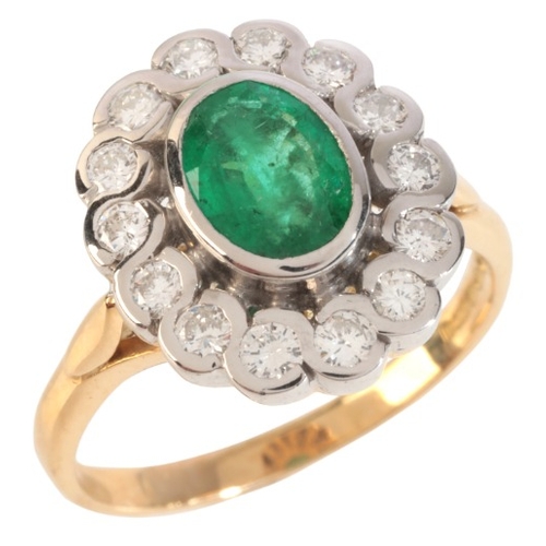 41 - AN EMERALD AND DIAMOND CLUSTER RING

in 18ct gold, set with an oval cut emerald, held in a bezel set... 