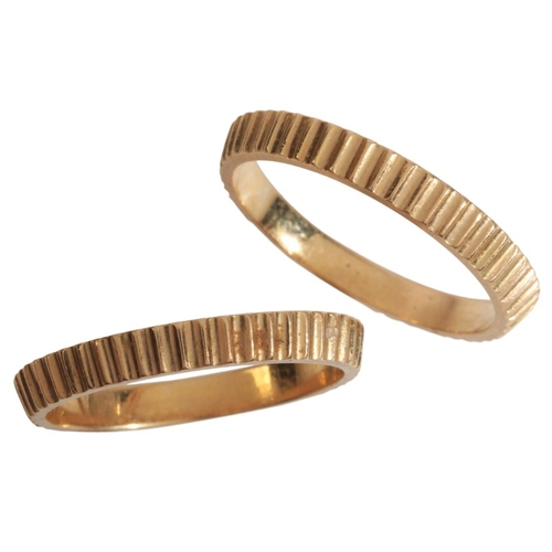 43 - A PAIR OF VINTAGE STACKING RINGS

in 18ct gold, each with a tapering fluted design, maker's mark 'CG... 