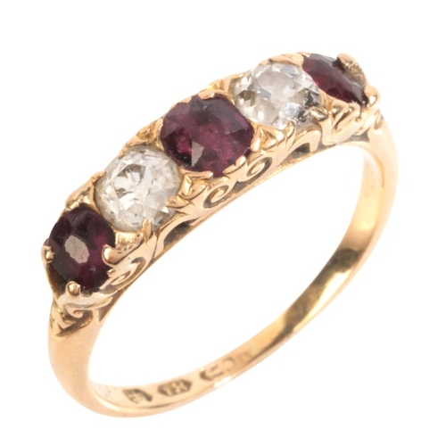 44 - AN ANTIQUE DIAMOND AND RUBY FIVE STONE RING

in 18ct gold, set with cushion cut rubies, alternating ... 