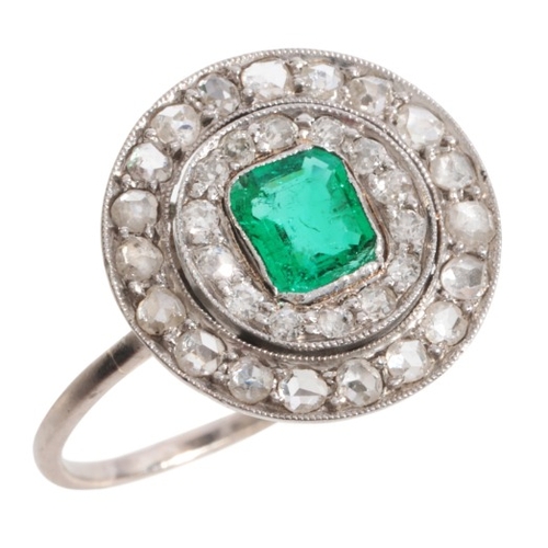 48 - AN EMERALD AND DIAMOND CLUSTER RING

in platinum, set with a step cut emerald of c.0.50 carats, surr... 