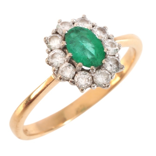 55 - AN EMERALD AND DIAMOND CLUSTER RING

in 18ct gold, set with an oval cut emerald, surrounded by a clu... 