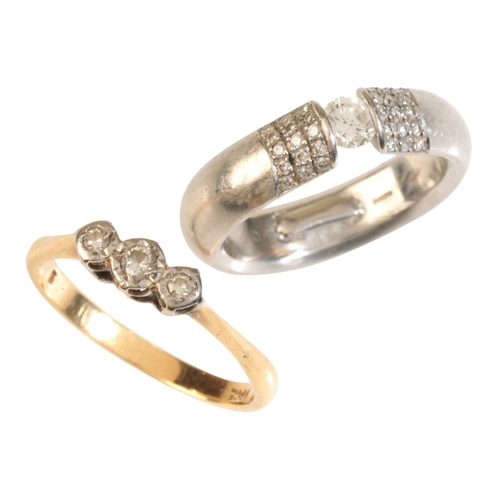 59 - A DIAMOND THREE STONE RING

in 18ct gold and platinum, set with three graduating round cut diamonds,... 