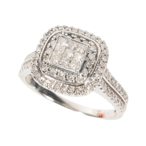 65 - A DIAMOND CLUSTER RING

in 18ct white gold, set to the centre with princess cut diamonds, surrounded... 