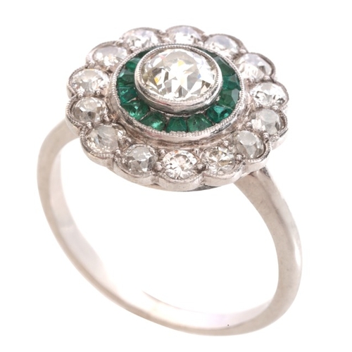 79 - A DIAMOND AND EMERALD CLUSTER RING

in platinum, set with an old cut diamond of c.0.62 carats, held ... 