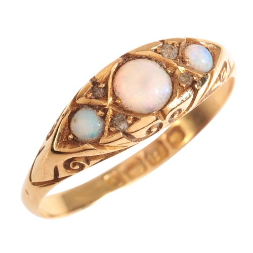 9 - AN ANTIQUE OPAL AND DIAMOND THREE STONE RING

in 18ct gold, set with three graduated opal cabochons,... 