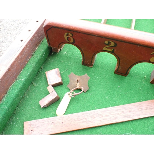 106 - A MAHOGANY CASED BAR BILLIARDS GAME

109 x 53 x 14cm (part of catch and escutcheon missing)