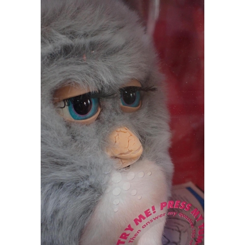 112 - FOUR BOXED EMOTO-TRONIC FURBIES

released 2005, some damage to boxes and to beaks; together with one... 