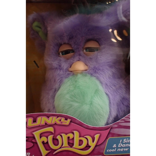 112 - FOUR BOXED EMOTO-TRONIC FURBIES

released 2005, some damage to boxes and to beaks; together with one... 