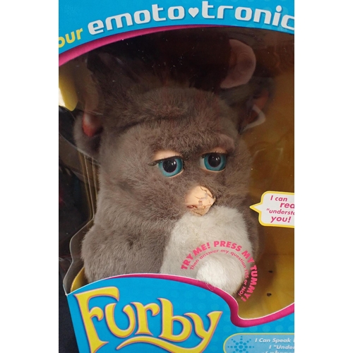 112 - FOUR BOXED EMOTO-TRONIC FURBIES

released 2005, some damage to boxes and to beaks; together with one... 