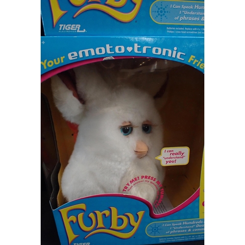 112 - FOUR BOXED EMOTO-TRONIC FURBIES

released 2005, some damage to boxes and to beaks; together with one... 