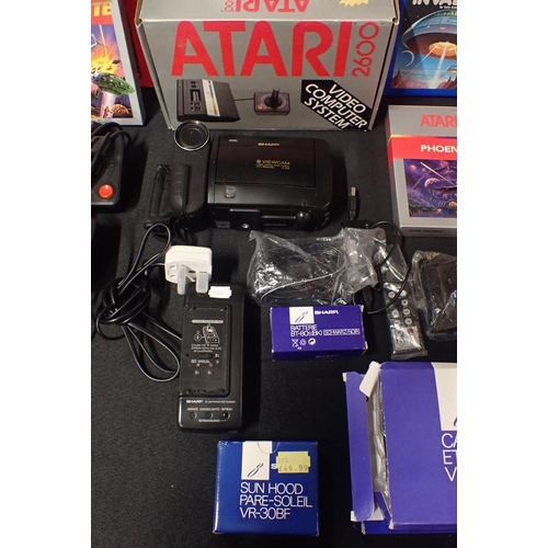 113 - A VINTAGE ATARI 2600 'VIDEO COMPUTER SYSTEM'

no. S.N x70830411956, boxed, with games including JR. ... 