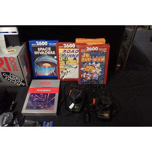 113 - A VINTAGE ATARI 2600 'VIDEO COMPUTER SYSTEM'

no. S.N x70830411956, boxed, with games including JR. ... 