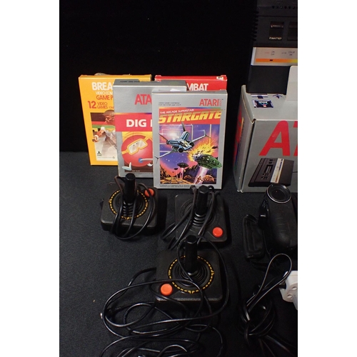 113 - A VINTAGE ATARI 2600 'VIDEO COMPUTER SYSTEM'

no. S.N x70830411956, boxed, with games including JR. ... 