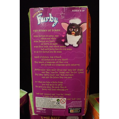 129 - SIX BOXED ORGINAL 1998 FURBIES

including a tagged original Tie Dye Rainbow Furby. Some damage to th... 