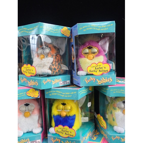 145 - NINE ORIGINAL FURBY BABIES

all tagged Furby originals (some wear to boxes) (9)