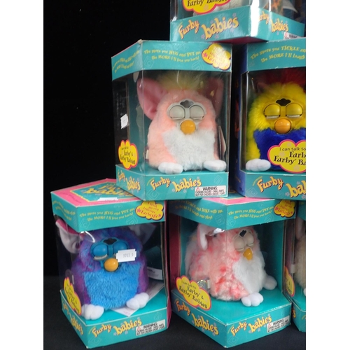 145 - NINE ORIGINAL FURBY BABIES

all tagged Furby originals (some wear to boxes) (9)