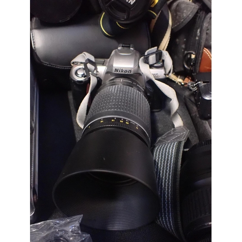 191 - A NIKON D40X SLR CAMERA AND LENS

a Nikon F65  with lens and Tamron SP lens and a quantity of other ... 