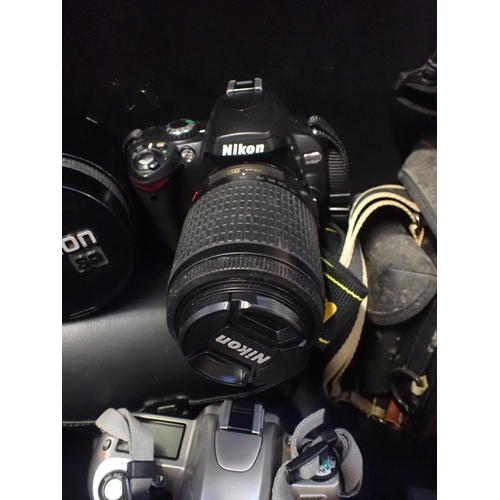 191 - A NIKON D40X SLR CAMERA AND LENS

a Nikon F65  with lens and Tamron SP lens and a quantity of other ... 