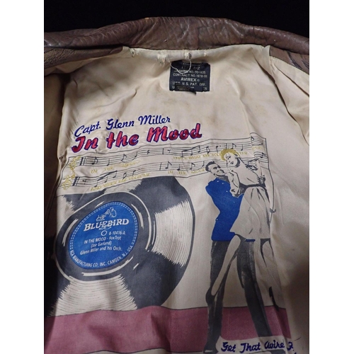 20 - AN AMERICAN AVIREX FLYING JACKET

with a Glenn Miller theme, 1991 replica, size 'L'