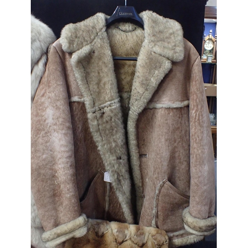 21 - A LADIES VINTAGE FUR FULL LENGTH COAT

with grey silk lining, a Nurseys sheepskin coat and a fur muf... 