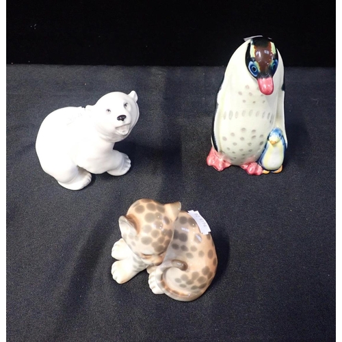 214 - THREE RUSSIAN PORCELAIN ANIMAL FIGURES

comprising penguin and chick, 16cm high, polar bear and leop... 