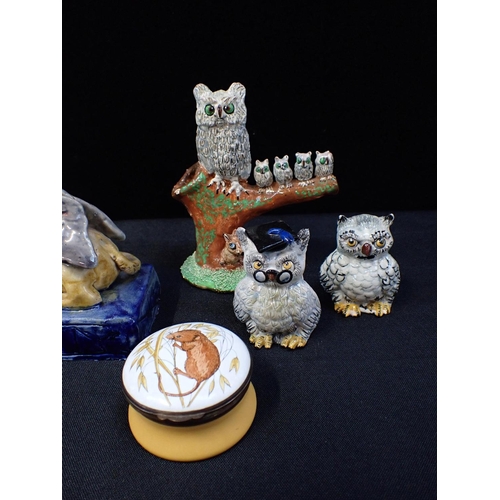 217 - THREE BASIL MATTHEWS STUDIO OWL FIGURES

a pair of pottery sphinx candlesticks, a Crummles enamel bo... 