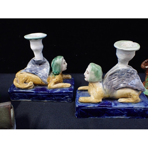 217 - THREE BASIL MATTHEWS STUDIO OWL FIGURES

a pair of pottery sphinx candlesticks, a Crummles enamel bo... 