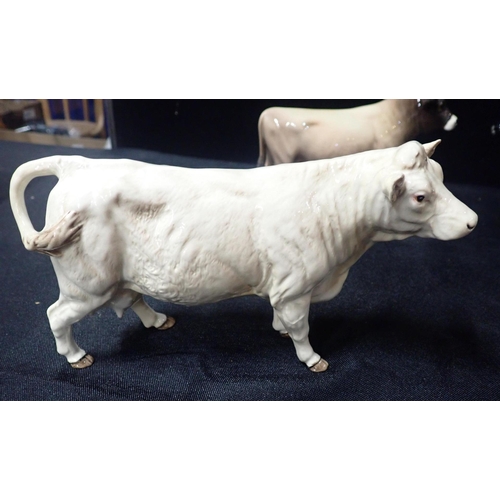 218 - THREE BESWICK POTTERY FIGURES OF BULLS

comprising Friesian, Charolais and Jersey 'Dunsley Coy Boy' ... 