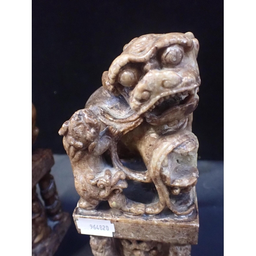 226 - A PAIR OF CARVED  SOAPSTONE DOGS OF FO

20 cm high