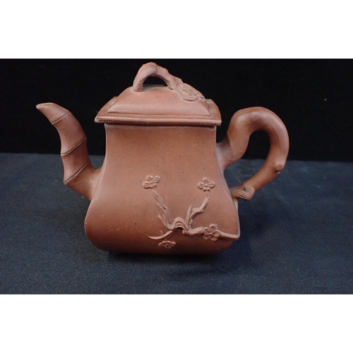 228 - A 19th CENTURY YIXING WARE TEAPOT

with seal mark 14cm high, a Chinese Republic saucer with wax seal... 